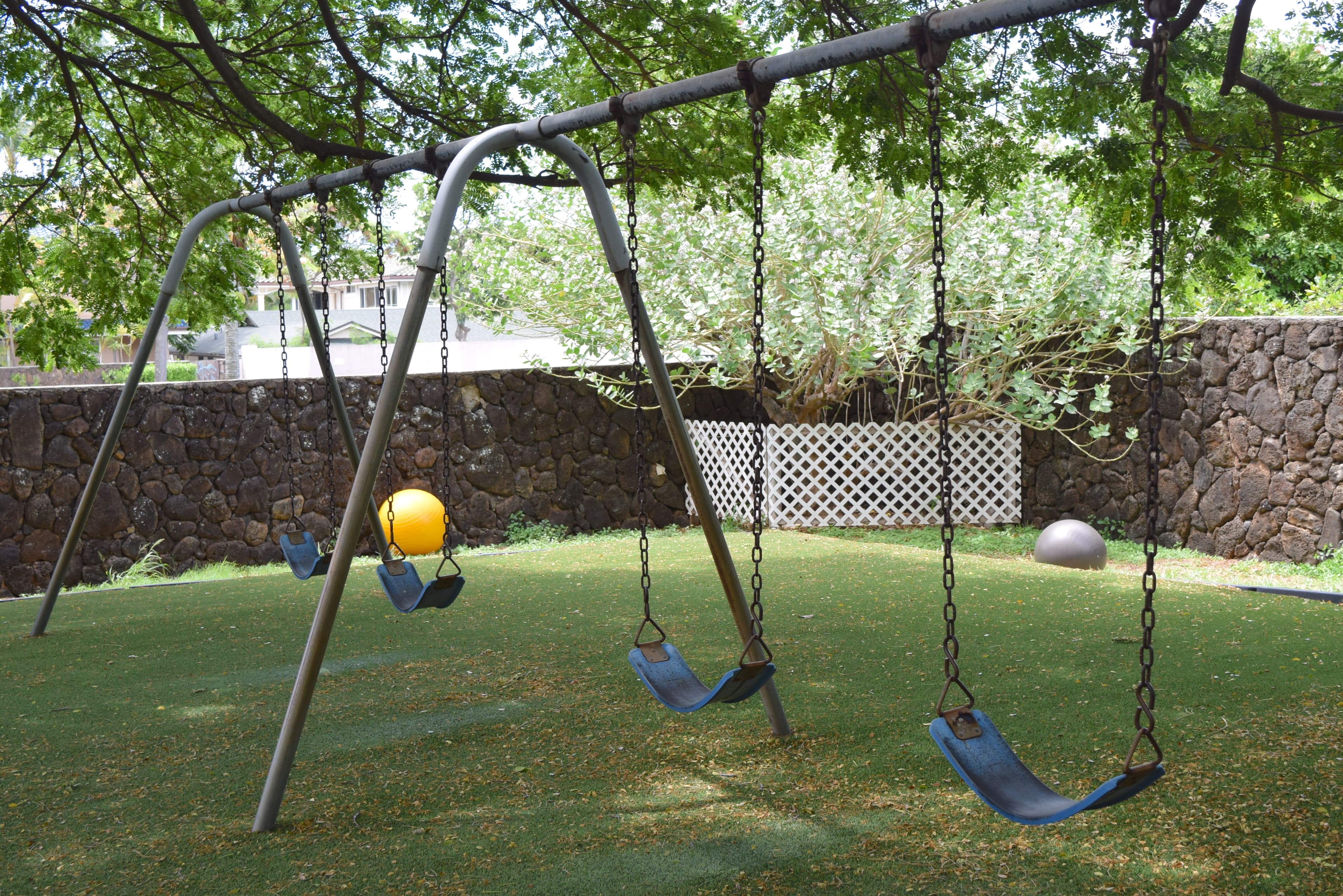 Swings under the trees